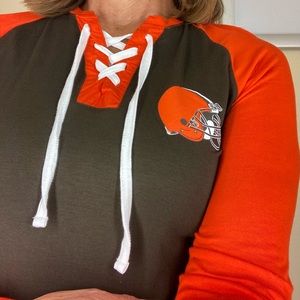 NWT MSRP: $50 Cleveland Browns women’s lace up T shirt. Licensed NFL apparel.